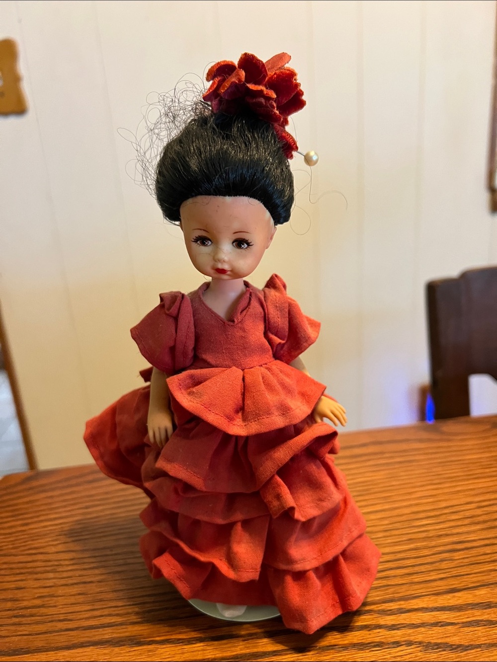 Red Ruffled Collectible Doll with Floral Hair Accent